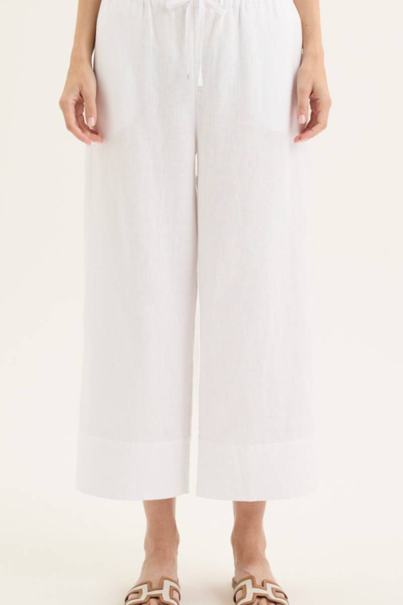 Front view of model wearing Yarra Trail Tirari Palazzo Pant in 100% linen — wide-leg 7/8 length style with elastic waistband and herringbone tie.