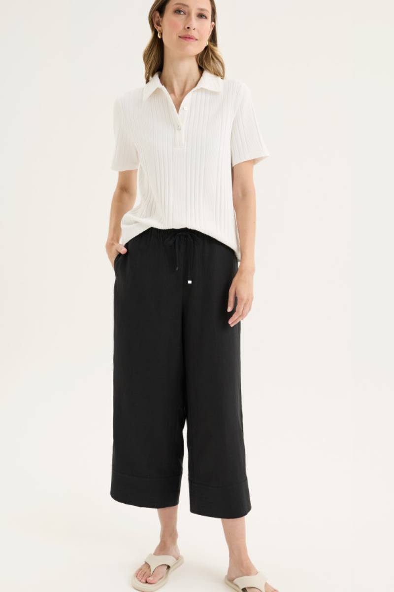 Model wearing Yarra Trail Tirari Palazzo Pant in 100% linen — wide-leg 7/8 length style with elastic waistband and herringbone tie.