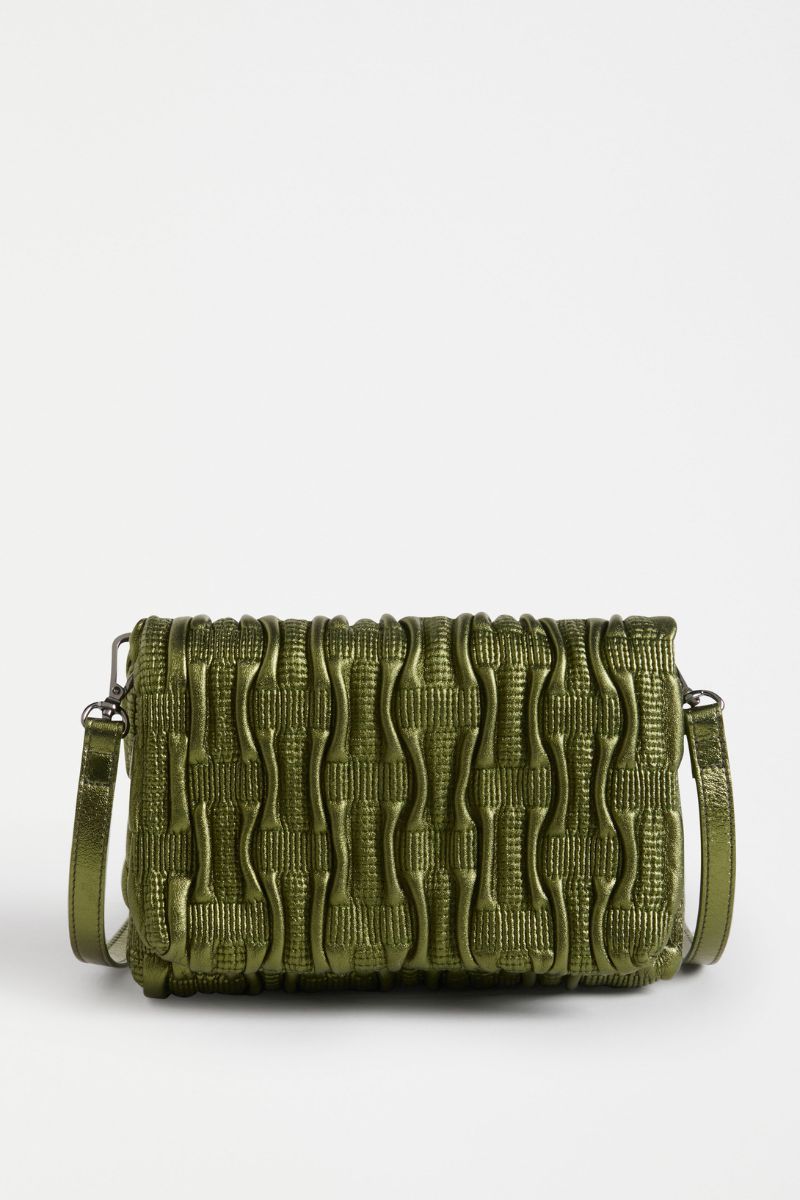 Green textured handbag on a white background