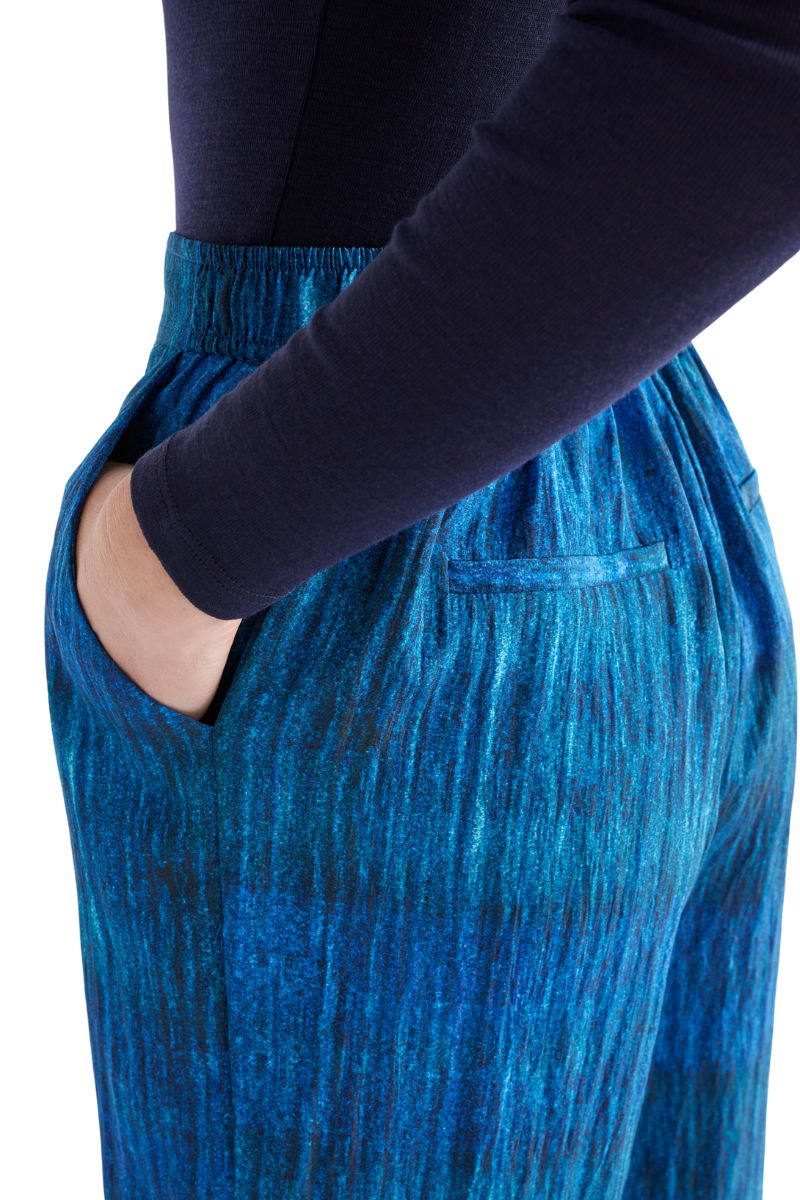 Blue pants with a dark blue top on a white background back view