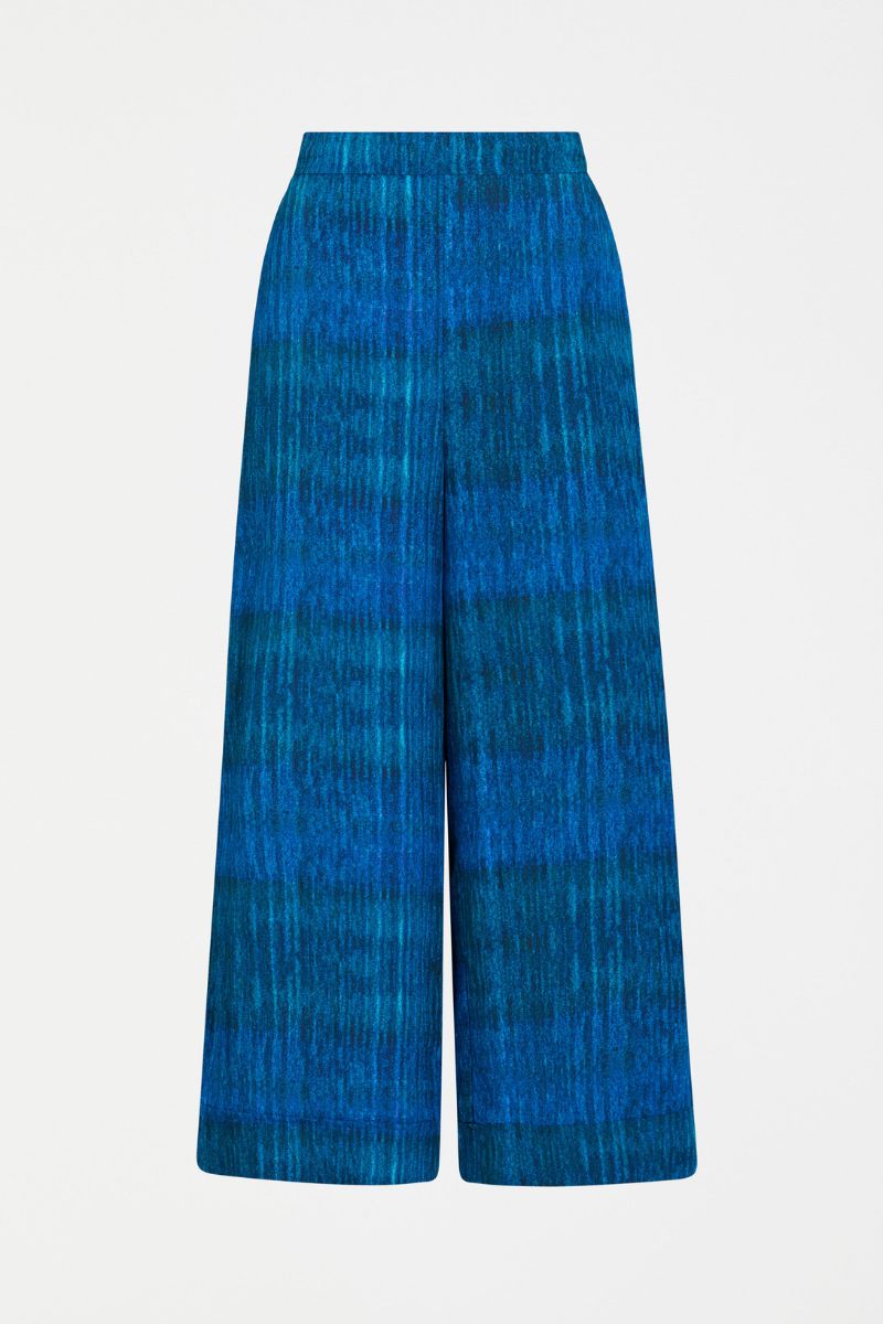 Blue patterned pants on a light gray background