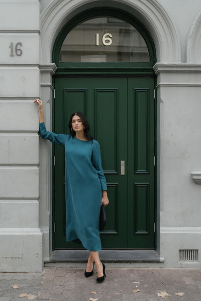 aubrey-dress-in-teal-humidity-lifestyle-front-view_1200x