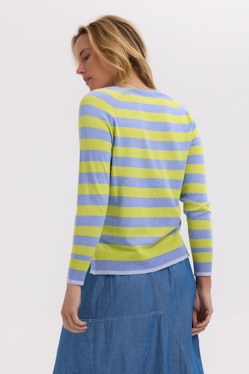 Woman wearing a striped sweater back view
