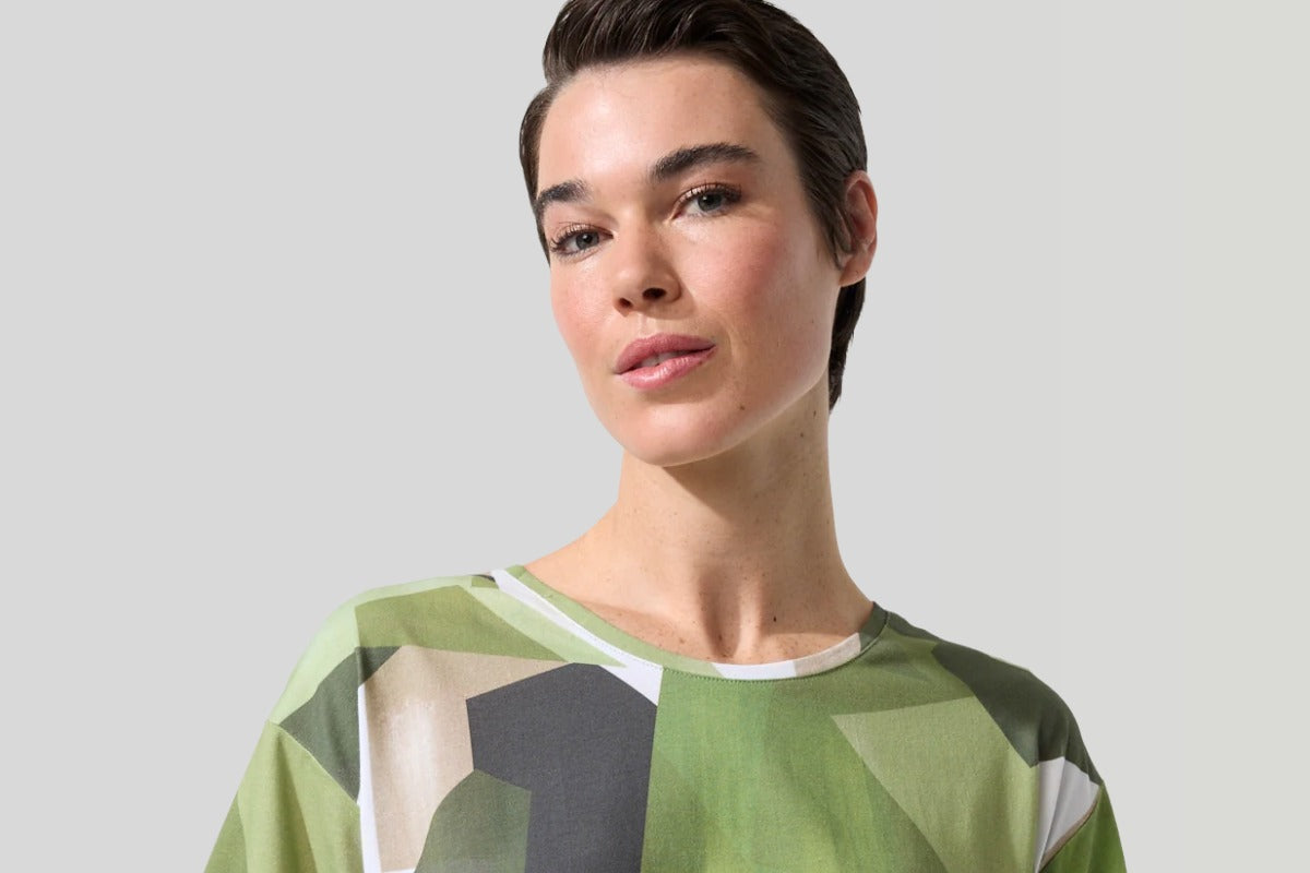 Marco Polo Nature Scape Tee in green geometric print — relaxed cotton top styled with khaki pants, available at Weekends Boutique.