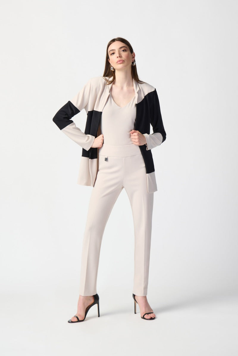 Model Wearing Joseph Ribkoff Wonder Pant 144092 Classic slim Pant in Moonstone with A moonstone V neck Tank and a Moonstone and Black Jacket