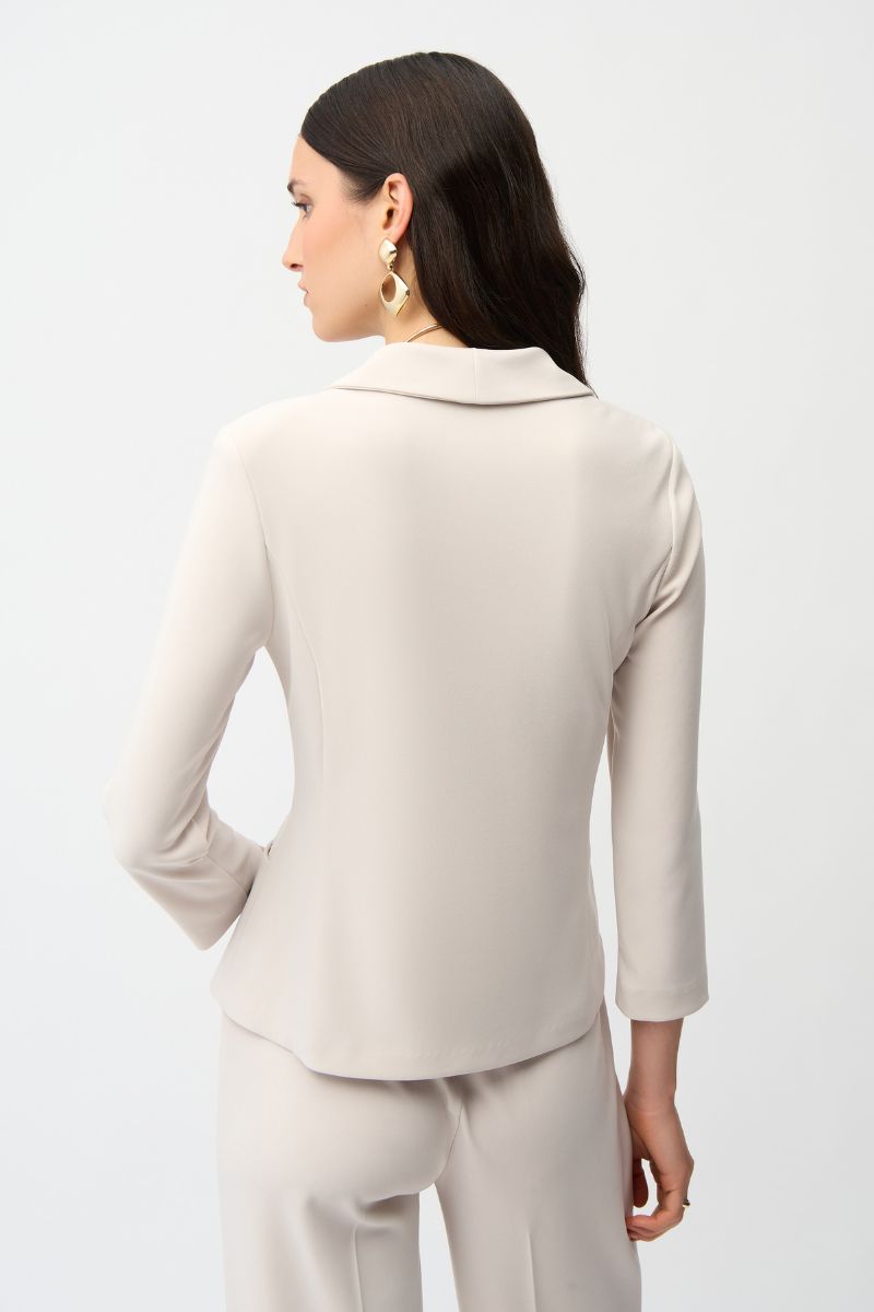 Woman wearing Joseph Ribkoff 261020 Silky Knit Fitted Blazer with Shawl Collar in Moonstone back view