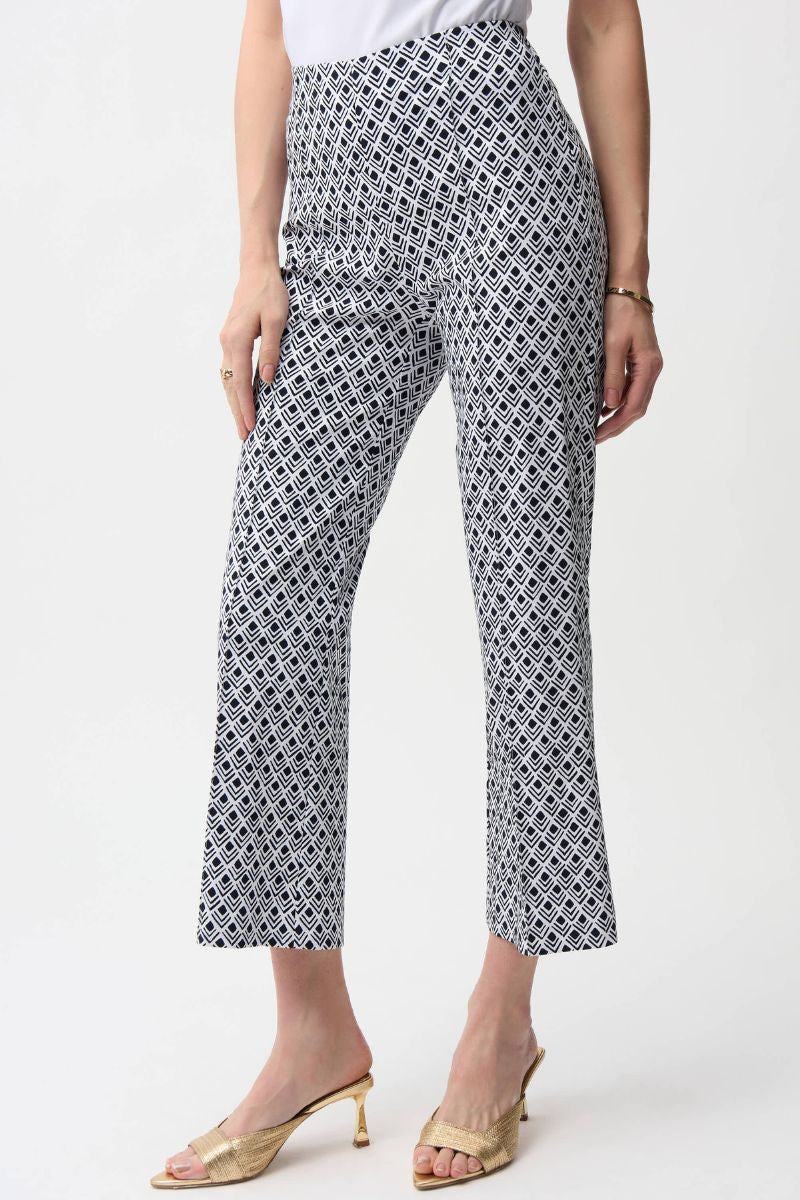 Woman wearing Joseph Ribkoff 261083 Millennium Flare Pants in Vanilla Midnight Print front view