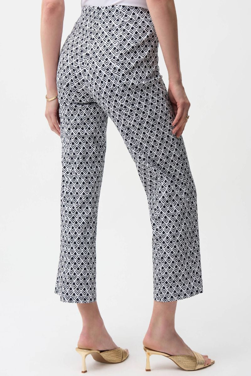 Woman wearing Joseph Ribkoff 261083 Millennium Flare Pants in Vanilla Midnight Print back view