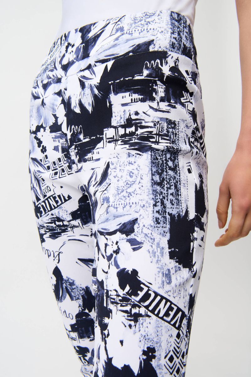 Woman wearing Joseph Ribkoff 261187 Millennium Conversational Print Crop Pull-On Pants in Navy back view
