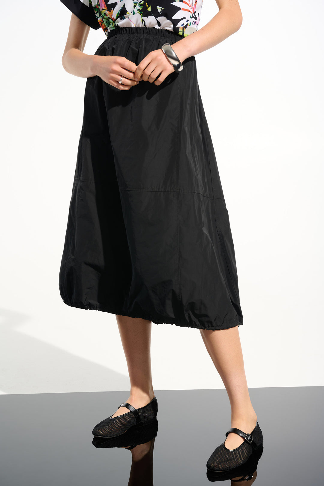 Woman wearing Joseph Ribkoff 261601 Memory Balloon Skirt with Elastic Waistband in Black front view