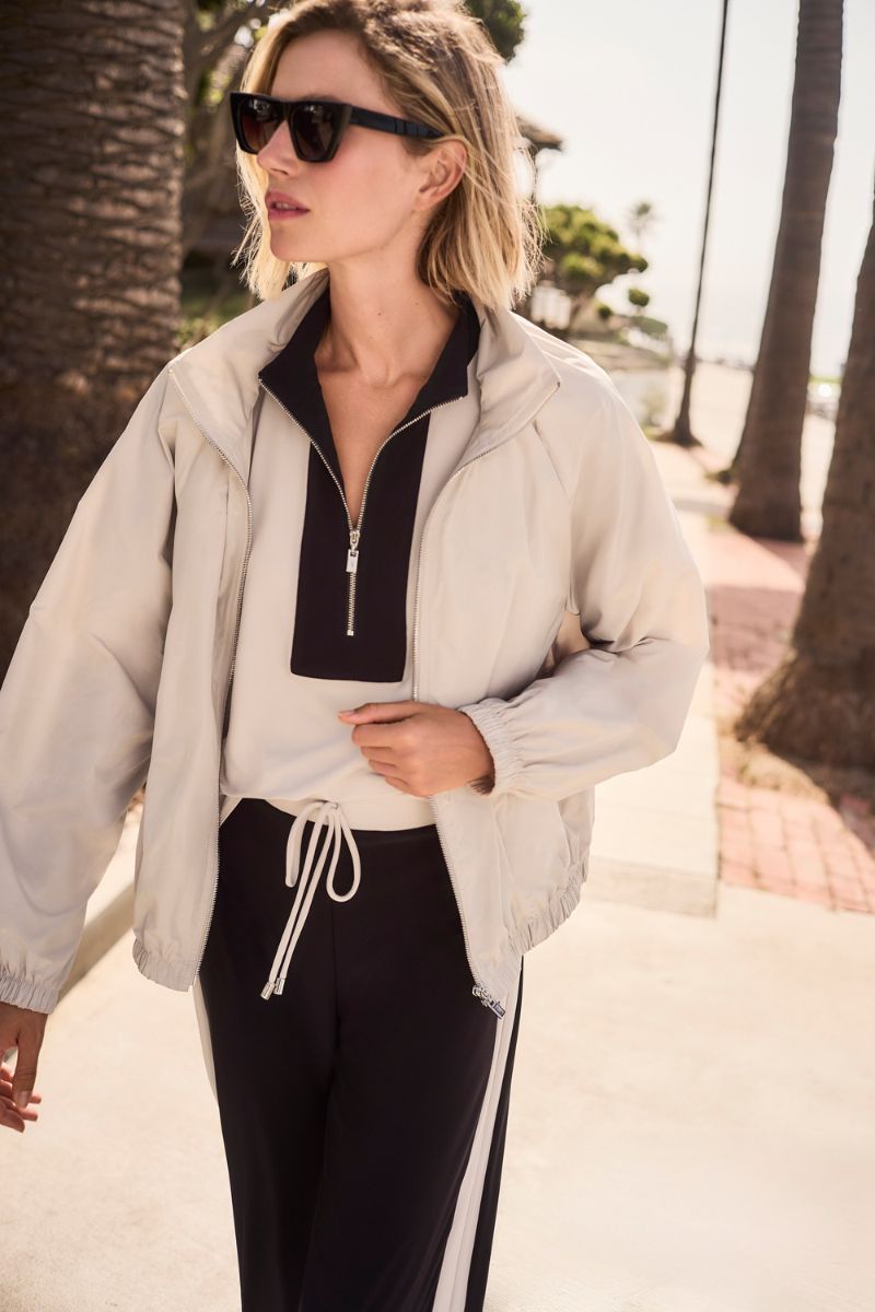 Woman wearing Joseph Ribkoff 261613 Memory Cocoon Outdoor Jacket styled outfit view in Moonstone