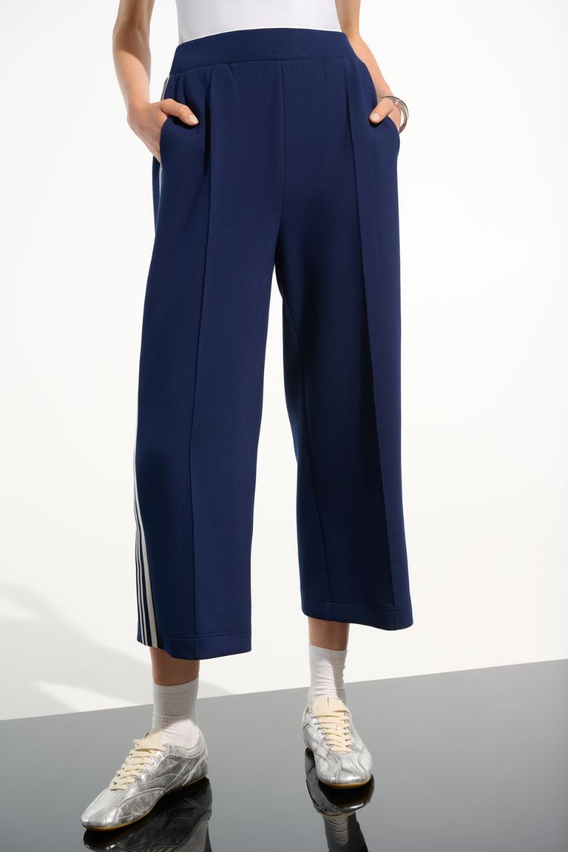 Woman wearing Joseph Ribkoff 261618 Scuba Jersey Pull-On Culotte Pants in Indigo Vanilla front view