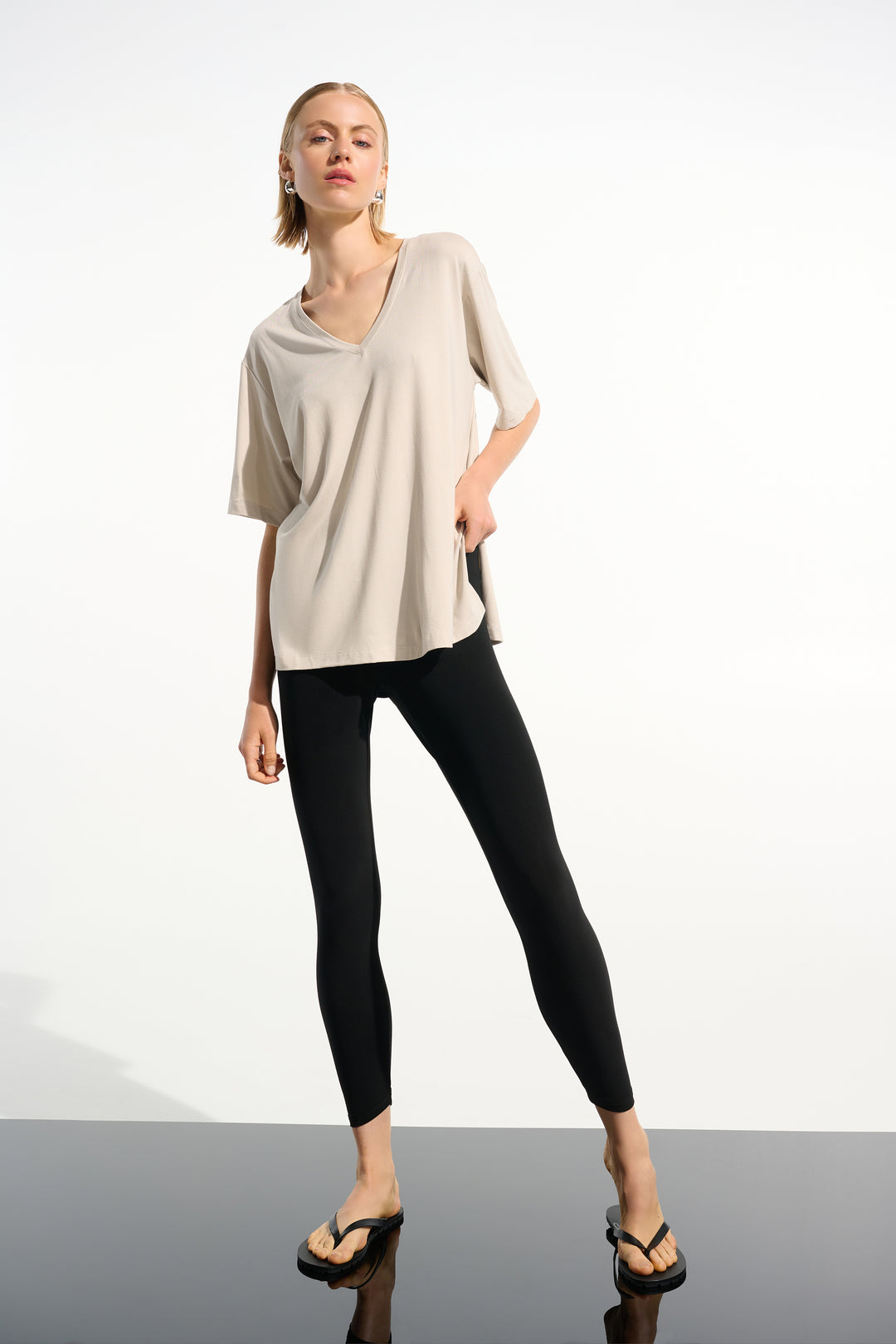 Woman wearing Joseph Ribkoff 261619 Silky Knit Pull-On Leggings styled outfit view in Black