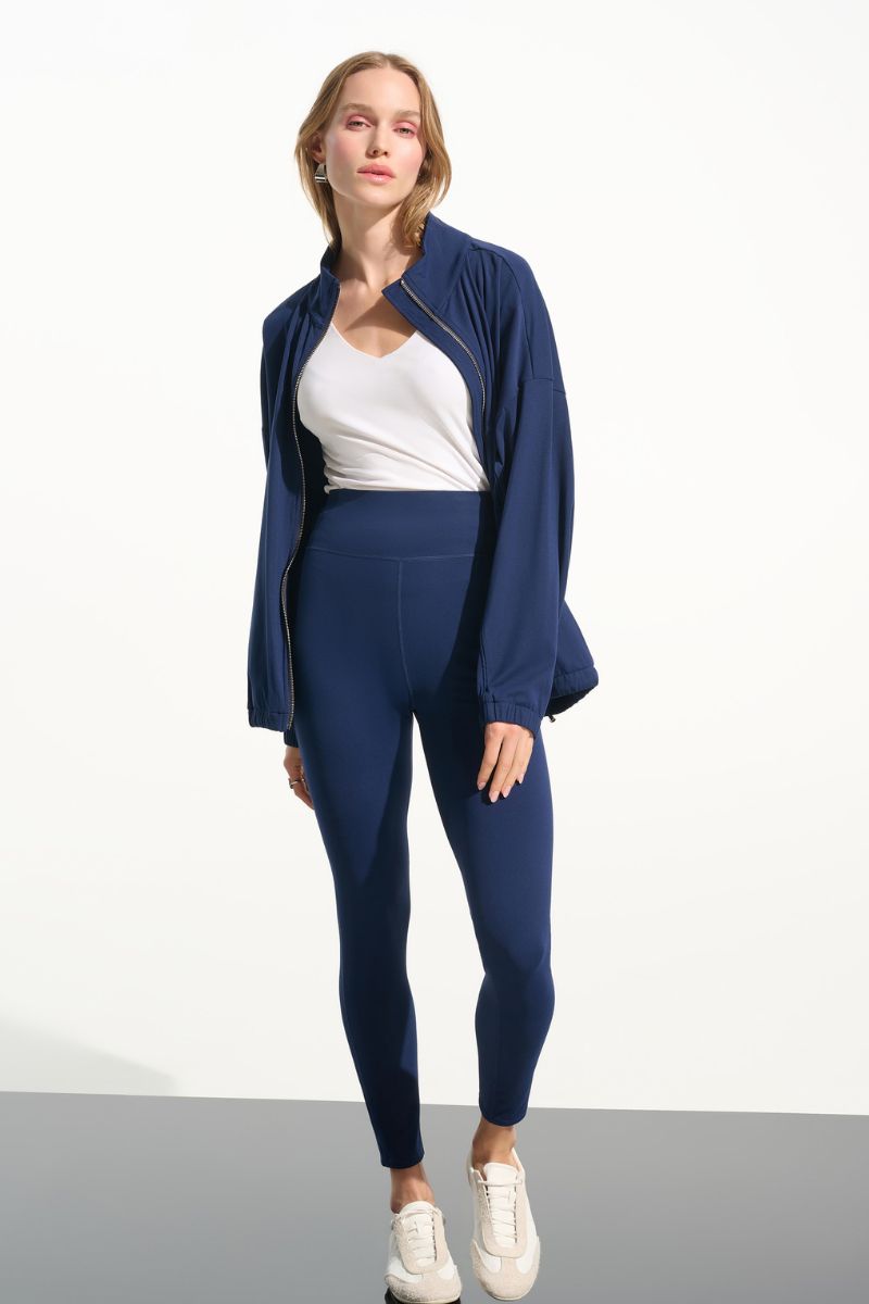 Woman wearing Joseph Ribkoff 261625 Nylon Spandex Compression Leggings styled outfit view in Indigo