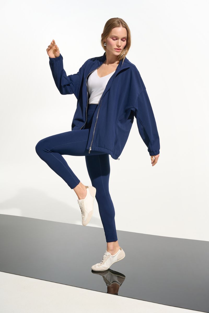 Woman wearing Joseph Ribkoff 261625 Nylon Spandex Compression Leggings side view in Indigo