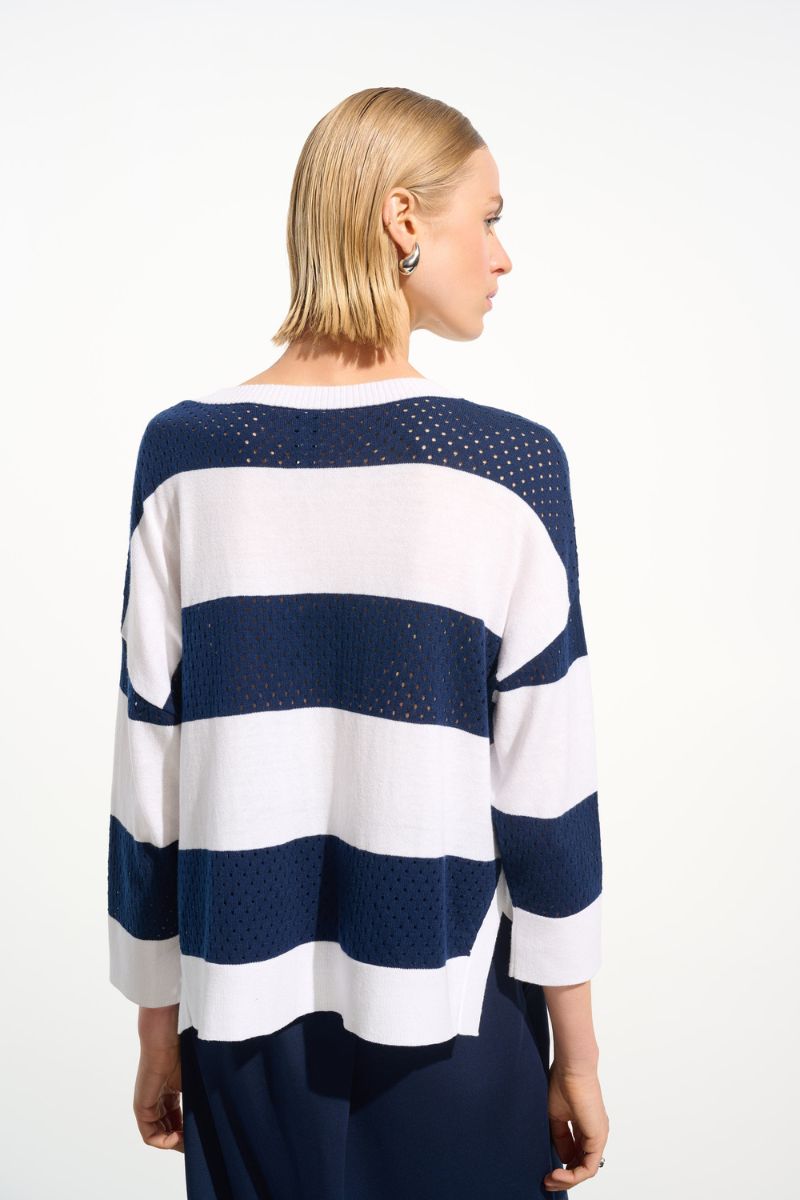 Woman wearing Joseph Ribkoff 261635 Cotton Blend Stripe Print Crewneck Sweater in Indigo Vanilla Stripe back view