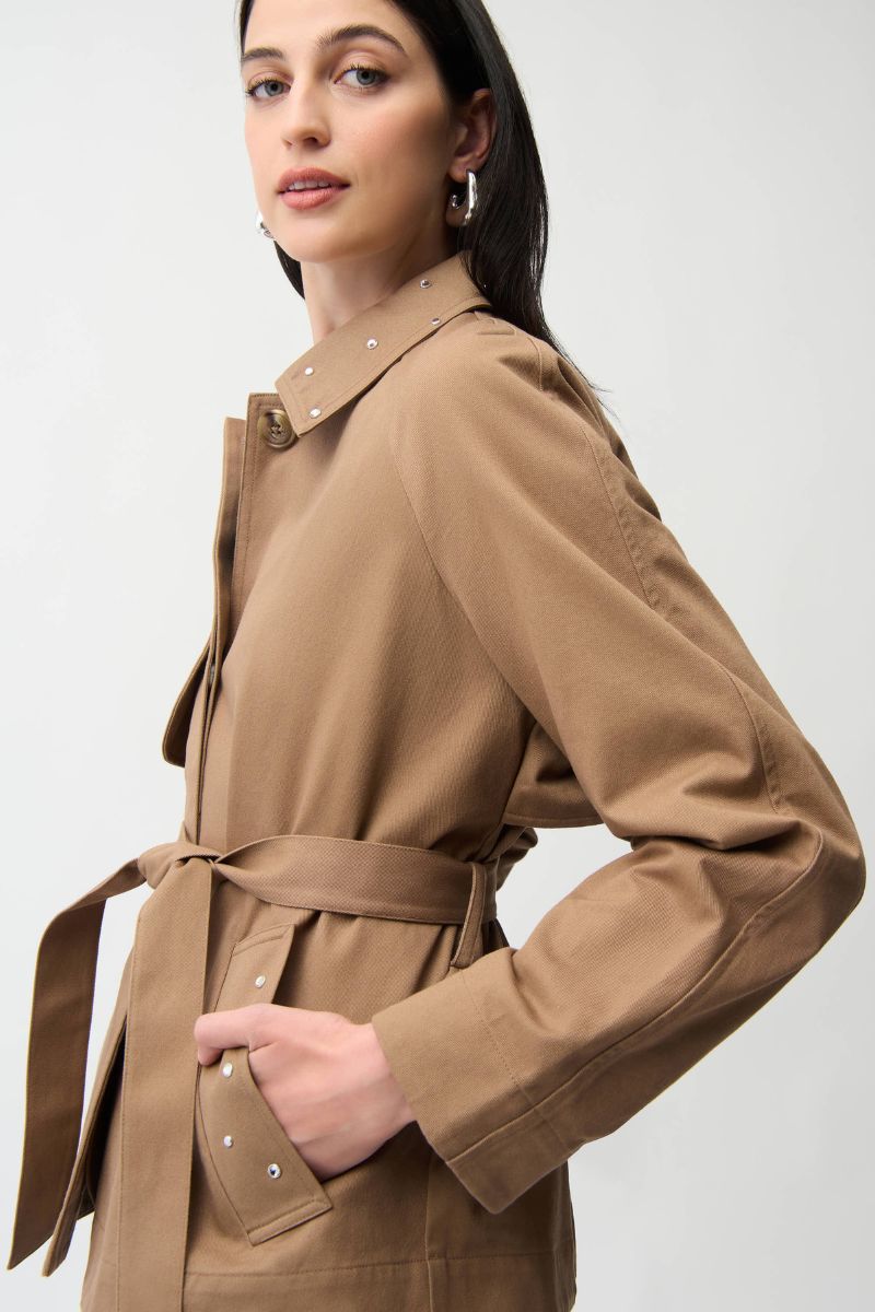 Woman wearing Joseph Ribkoff 261907 Cotton Twill Short Trench with Belt and Rhinestone Detail side view in Tiger’s Eye