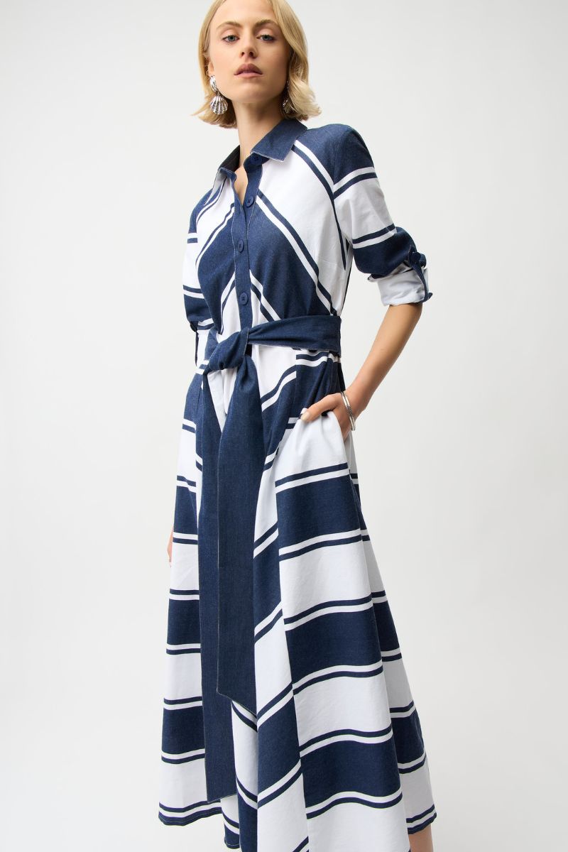 Woman wearing Joseph Ribkoff 261936 Cotton Stripe Print Fit and Flare Shirt Dress with Reversible Sash side view in Navy White Stripe