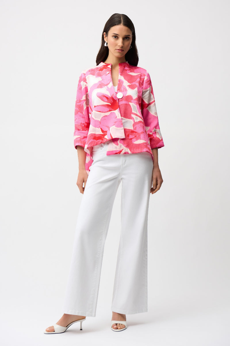 Woman wearing a pink floral joseph Ribkoff Jacket and white goldie featherweave Jeans  on a white background