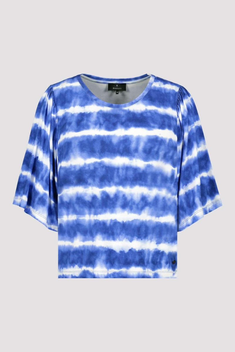 Blue and white tie-dye shirt on a light gray background