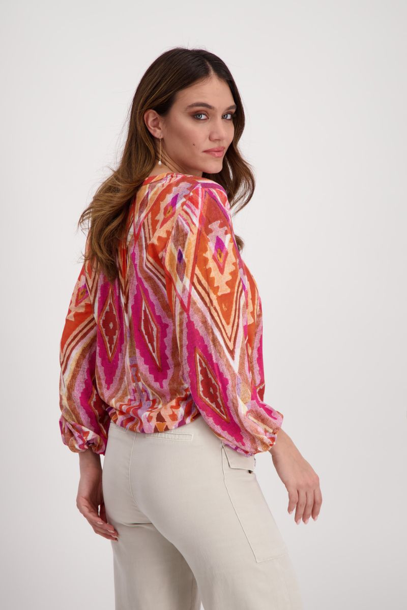 Woman wearing Monari 408788MNR Berry Ikat Blouse side view