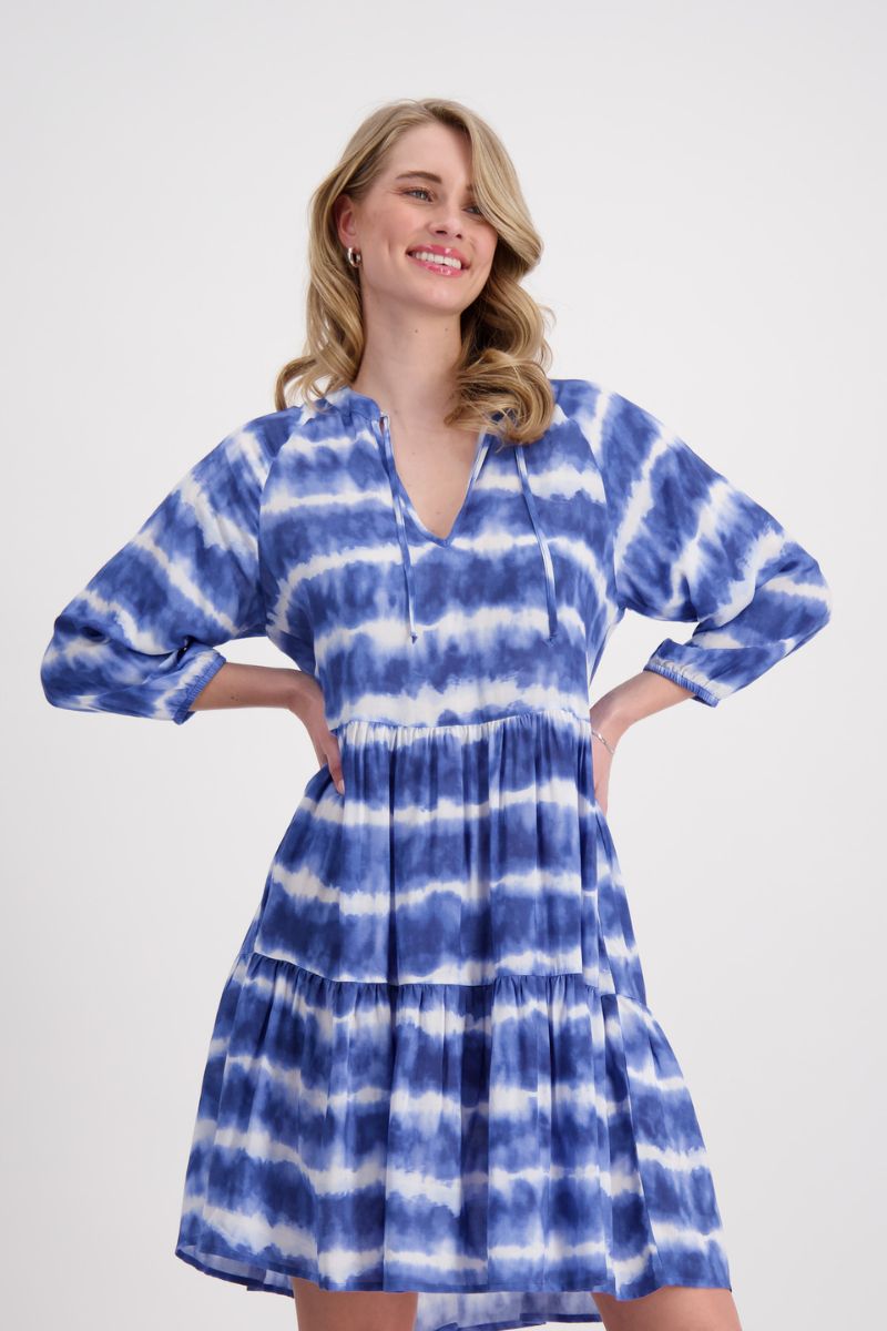 Woman wearing Monari 408856 Denim Blue Batik Stripe Dress flounce detail