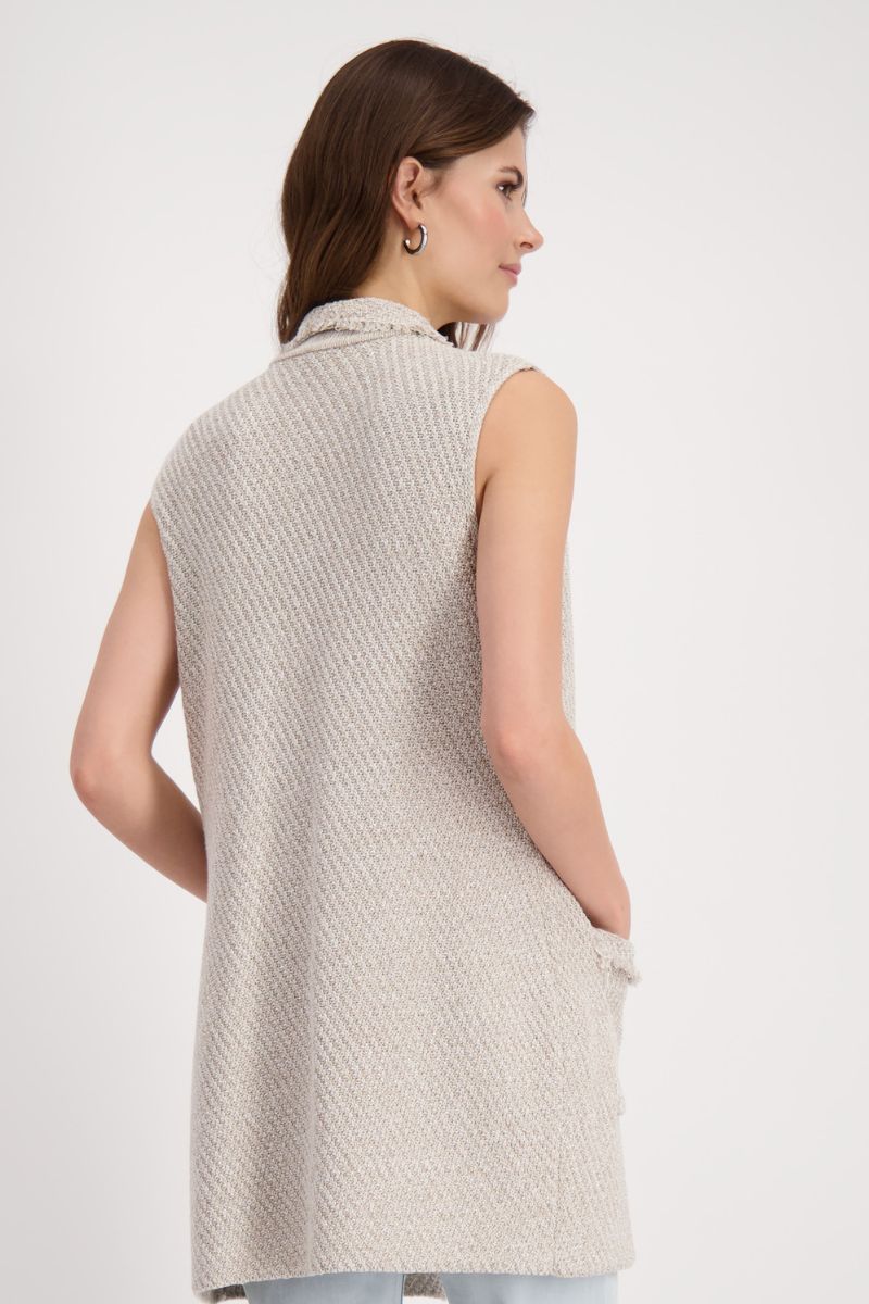 Woman wearing Monari 408900MNR knitted vest with fringed lapel in light sand back view