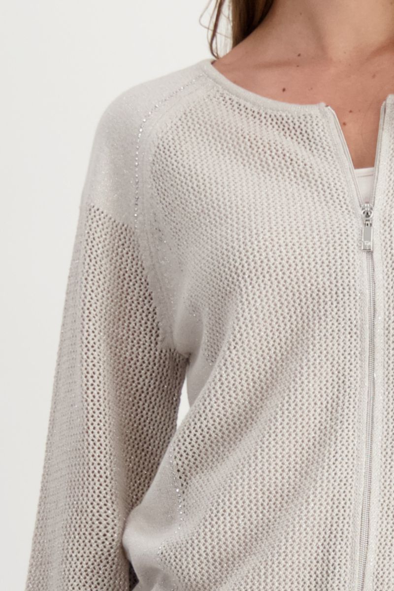 Woman wearing Monari 408926MNR lurex bomber-style relaxed jacket fabric detail in sand