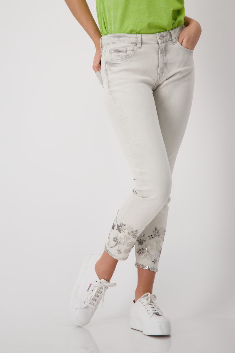 Woman wearing Monari 408957MNR embroidered denim jeans in marble front view