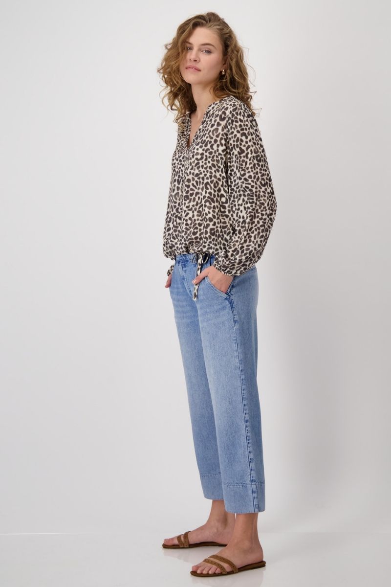 Woman wearing Monari 409202MNR Blouse All Over Leo Print side view