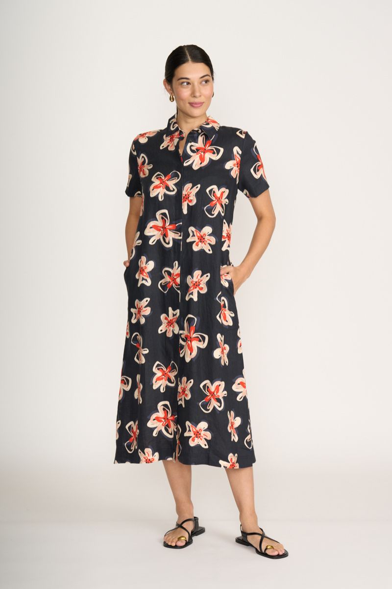 Advanced Interaction Dress By Foil clothing Woman wearing a black dress with floral pattern on a white background