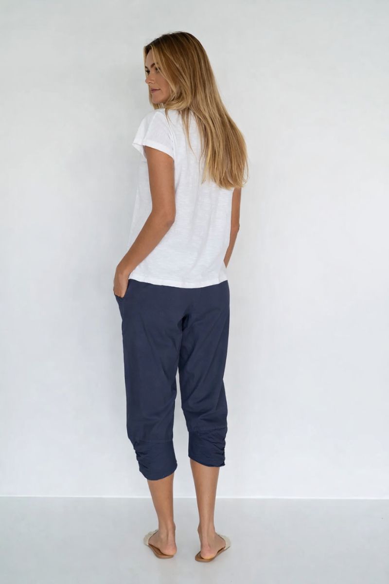 Woman wearing Humidity Lifestyle HS31010 Castaway Pant Navy back view