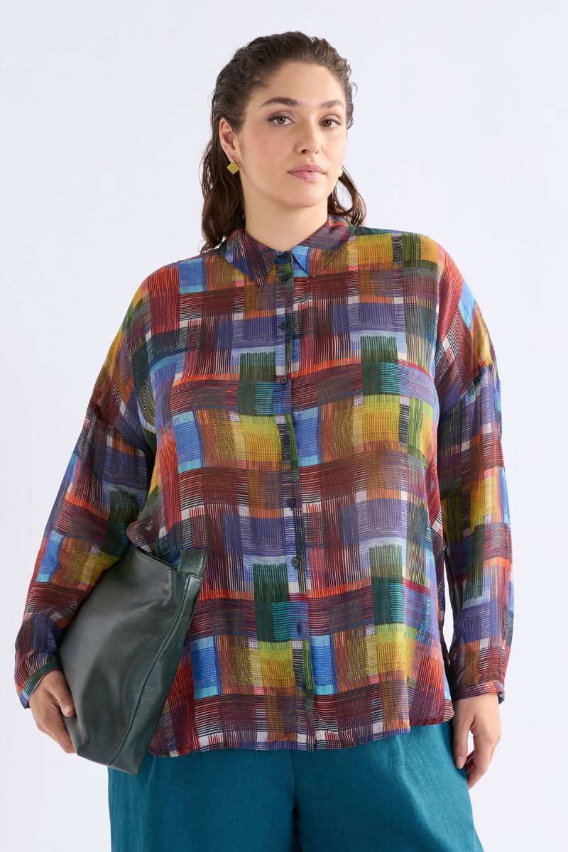 Woman wearing Elk the Label A1551 abstract check sheer shirt styled casually