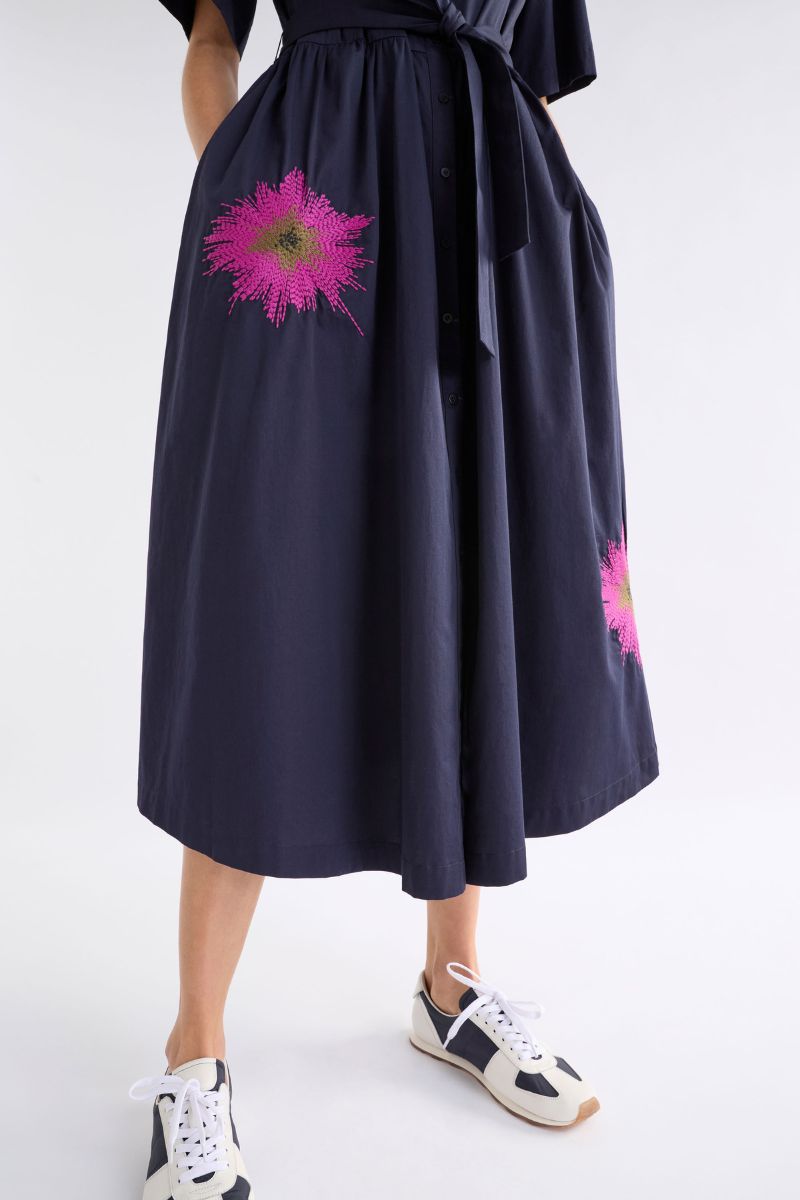 Woman wearing Elk the Label A1548 Eiren dress with floral embroidery detail