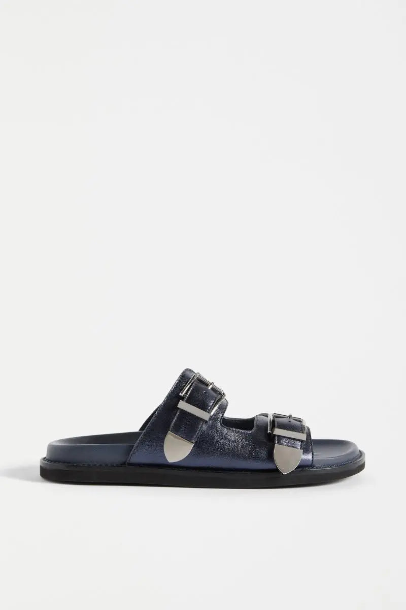 Navy sandal with silver buckles on a white background