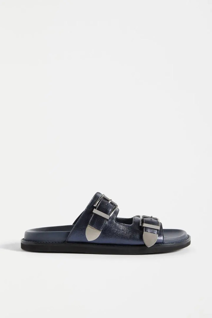 Navy sandal with silver buckles on a white background