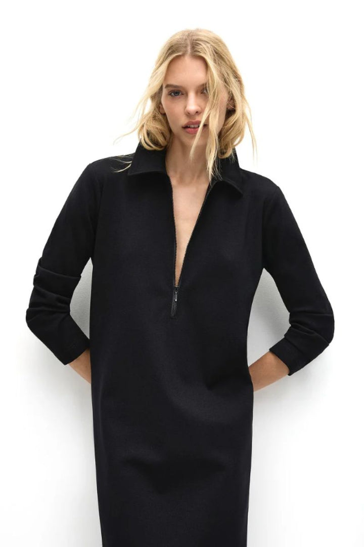 Close up view of zip collar dress black