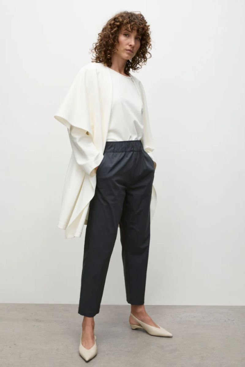 Model side view with Studio Shell and tapered flat pant by Mela Purdie