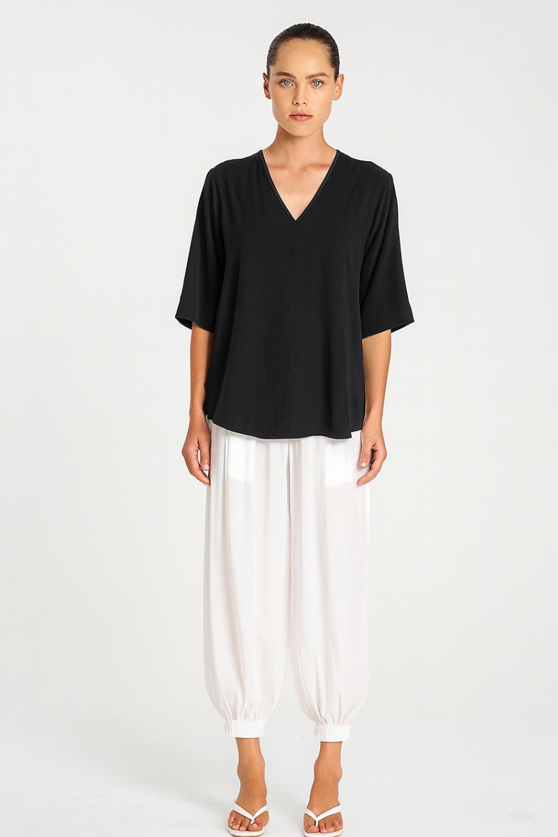 Woman wearing Mela Purdie F67 8839 Swish Plaza Top in Black front view