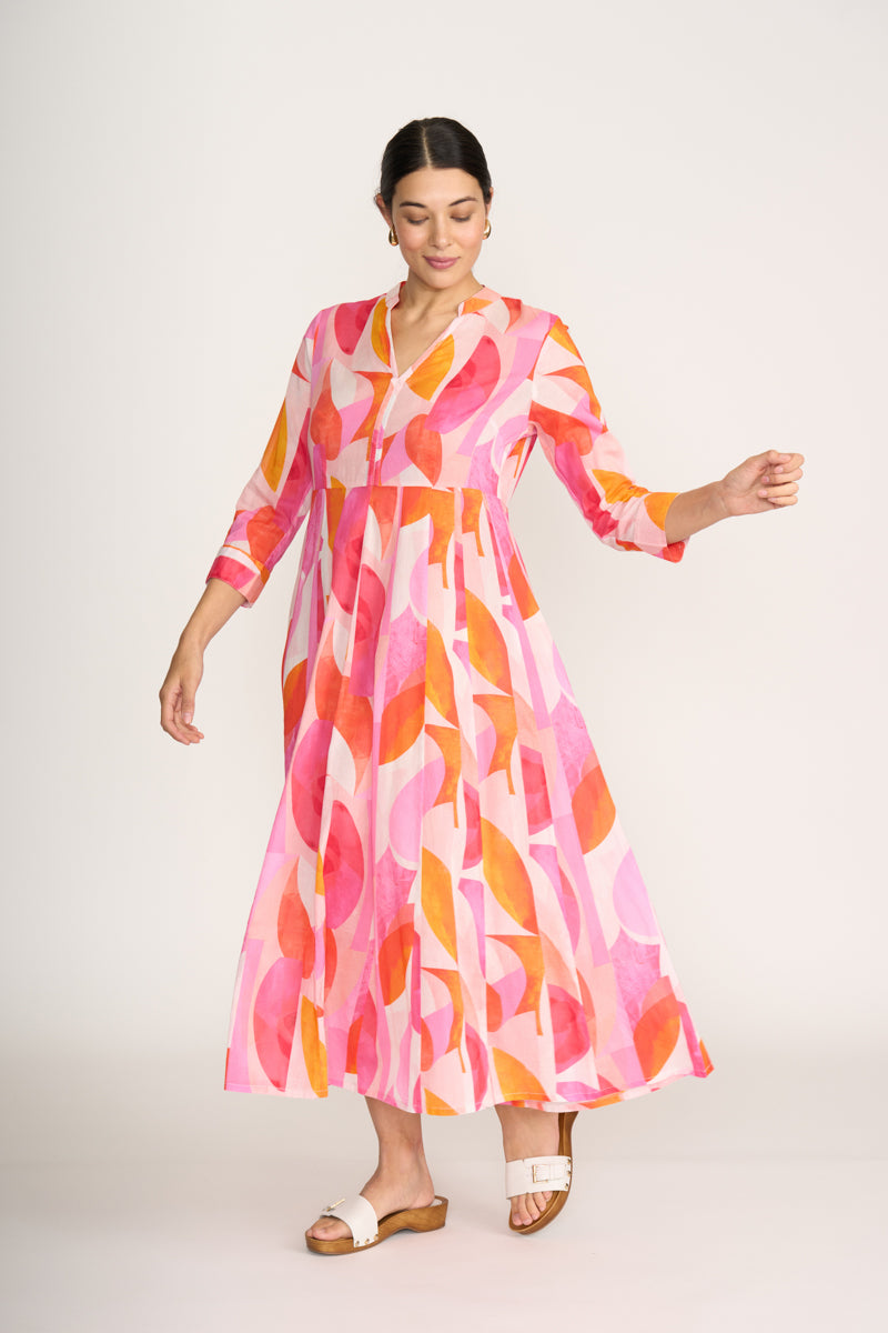 Woman wearing a colorful dress with a white background