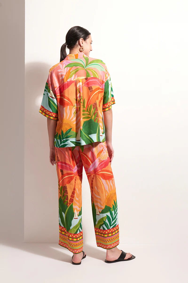 Back view of woman wearing Foil Box of Tricks Top in Sunkist Print FO8291