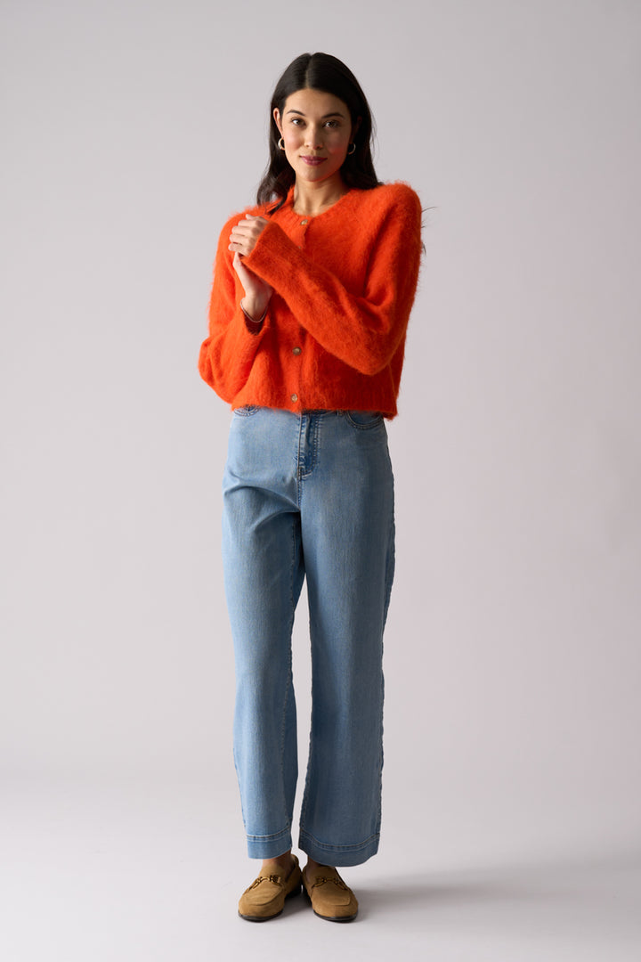 Woman wearing Loop of Luxury fluffy Cardi in Electric Orange by FOIL FO8374 front view 2