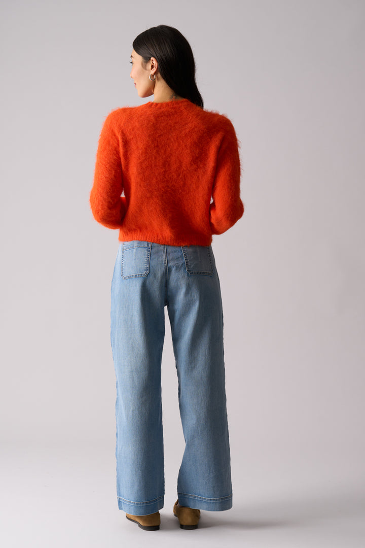 Woman wearing Loop of Luxury fluffy Cardi in Electric Orange by FOIL FO8374 back view