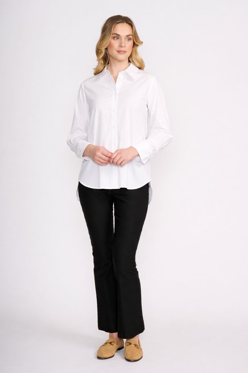 Woman wearing Push Up Shirt in White by FOIL FO8496 styled with black pant