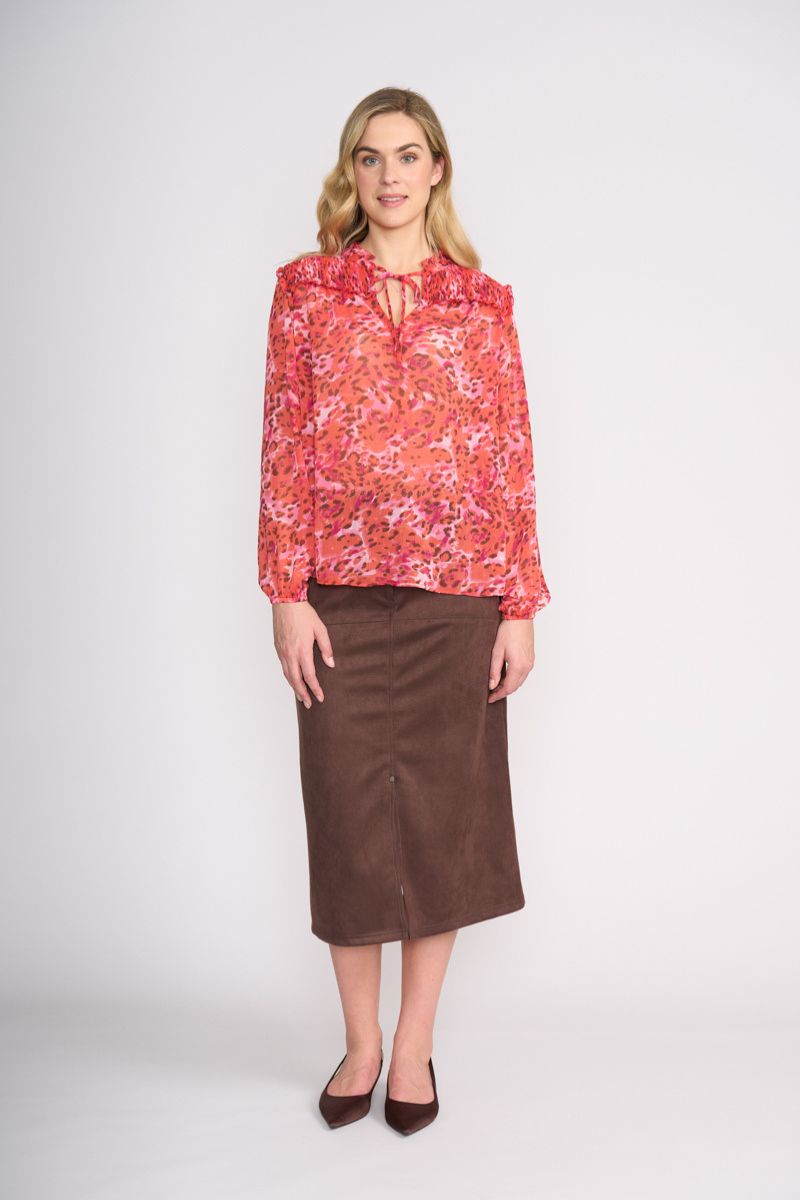 Woman wearing Stepping Out Blouse in Wild Life by FOIL FO8514 styled with skirt