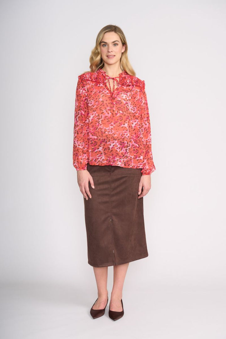 Woman wearing Stepping Out Blouse in Wild Life by FOIL FO8514 styled with skirt