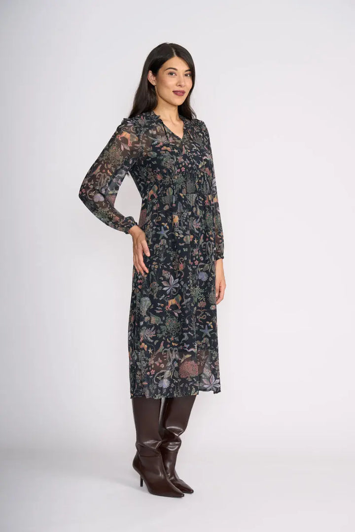 Woman wearing Tinder Twirl Dress in Narnia with a black background and multi pattern by FOIL FO8515 front angle view