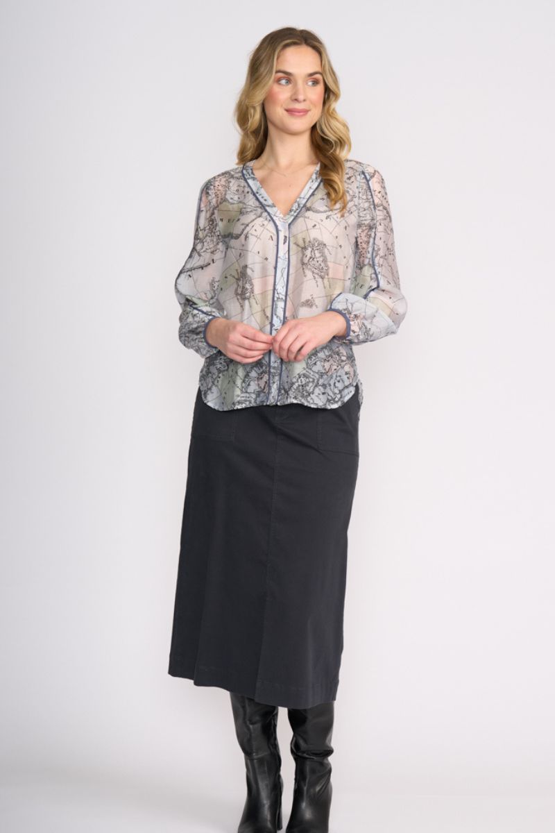 Woman wearing Pipeline Blouse in Globe by FOIL FO8510 styled with skirt