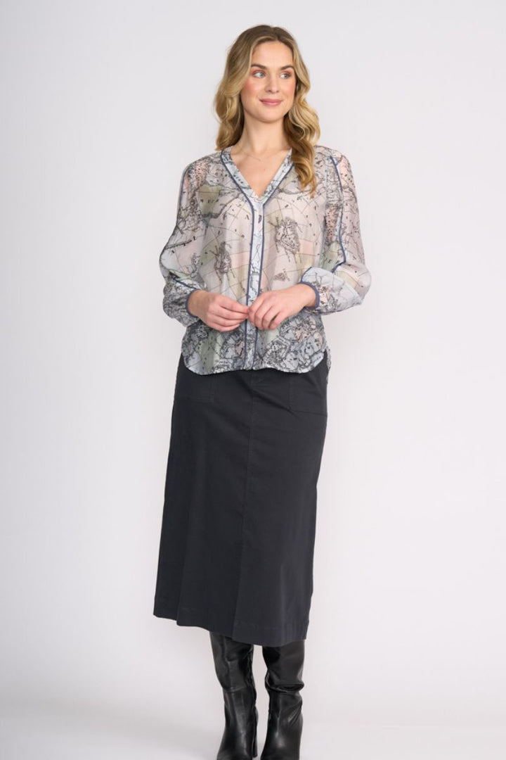 Woman wearing Pipeline Blouse in Globe by FOIL FO8510 styled with skirt