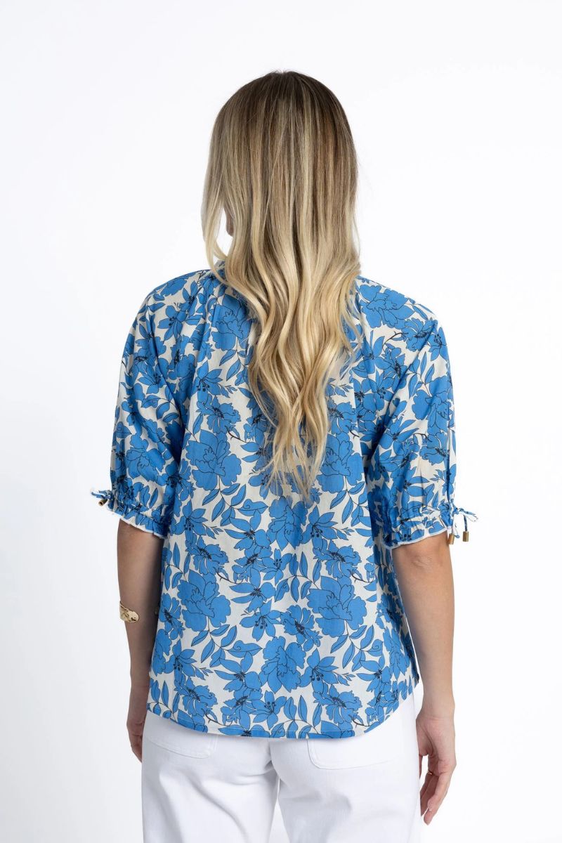 Woman wearing Humidity Lifestyle HS25101 Fleur Blouse Blue and Stone back view